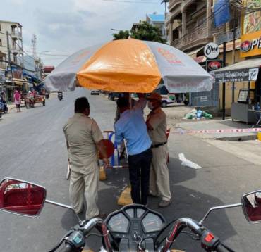 Sharing Umbrella, Drinking Wate, and Raincoat to Local Authorities