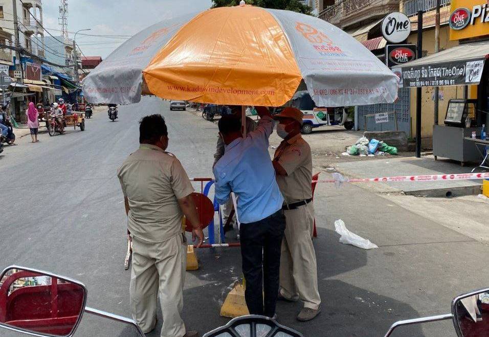 Sharing Umbrella, Drinking Wate, and Raincoat to Local Authorities